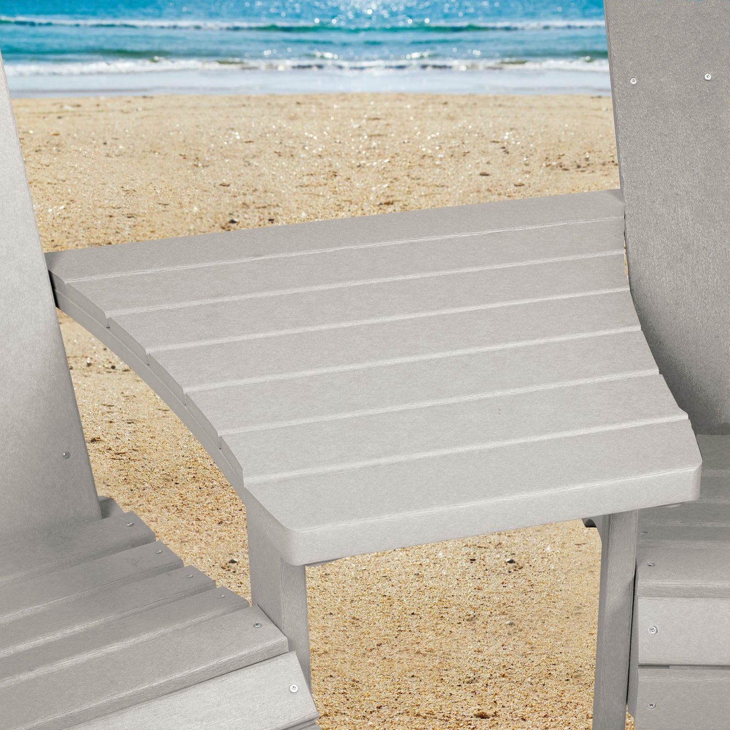 Gray Sunrise Coast comfort height chairs and connecting table on beach