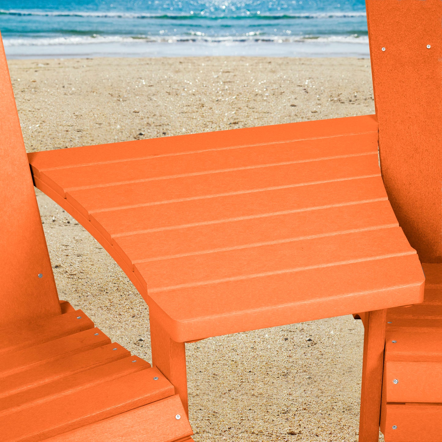 Orange Sunrise Coast comfort height chairs and connecting table on beach