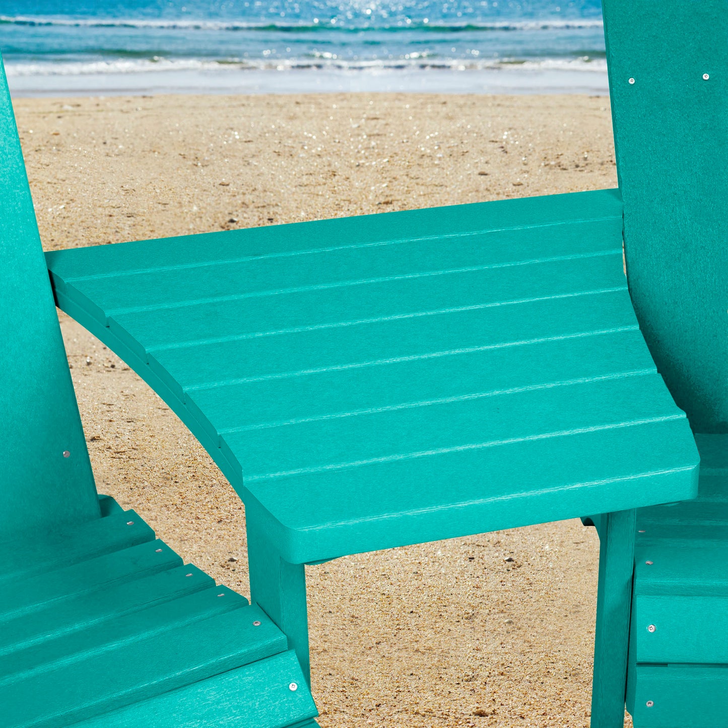 Blue Sunrise Coast comfort height chairs and connecting table on beach