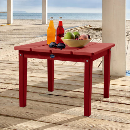 Red Sunrise Coast large side table with drinks, fruit, and sunglasses