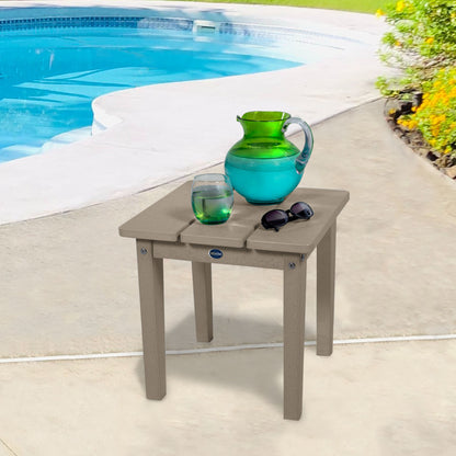 Tan Sunrise Coast small side table with water and sunglasses by a pool