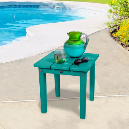 Blue Sunrise Coast small side table with water and sunglasses by a pool
