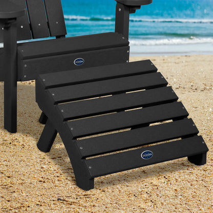 Black Sunrise Coast folding ottoman and Adirondack chair on beach