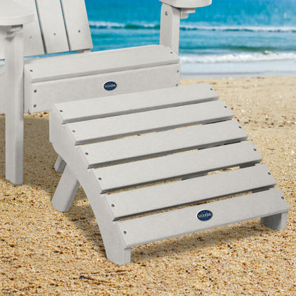 Gray Sunrise Coast folding ottoman and Adirondack chair on beach