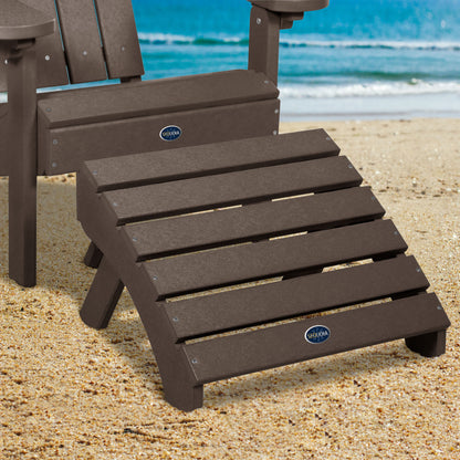 Brown Sunrise Coast folding ottoman and Adirondack chair on beach