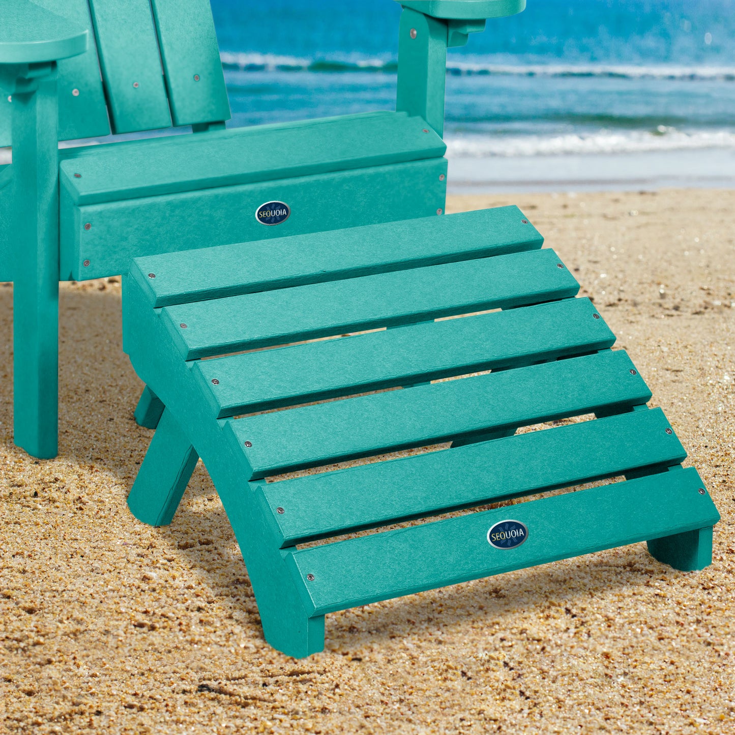 Blue Sunrise Coast folding ottoman and Adirondack chair on beach