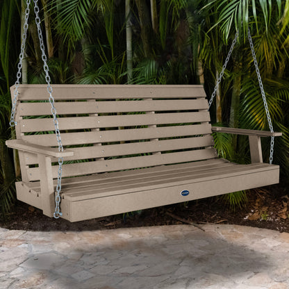 Tan Sunrise Coast 5ft porch swing with palms in background
