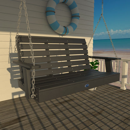 Black Sunrise Coast 4ft porch swing on a deck with life preserver