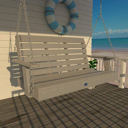 Gray Sunrise Coast 4ft porch swing on a deck with life preserver