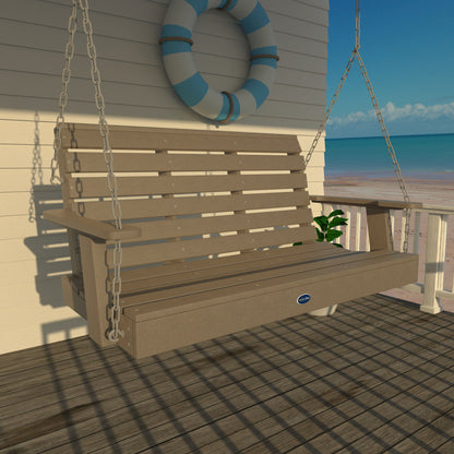 Tan Sunrise Coast 4ft porch swing on a deck with life preserver