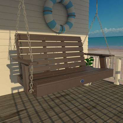 Brown Sunrise Coast 4ft porch swing on a deck with life preserver