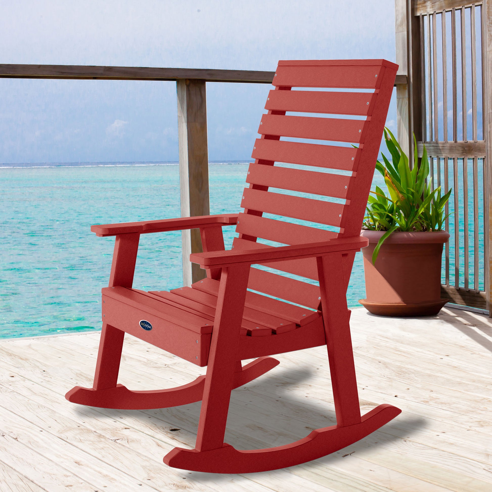 Red Sunrise Coast rocking chair on deck overlooking water