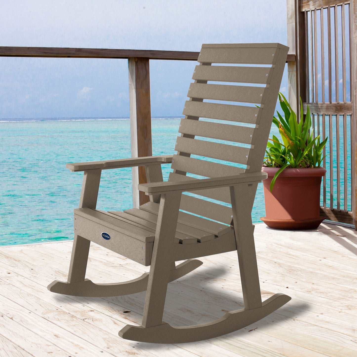 Tan Sunrise Coast rocking chair on deck overlooking water