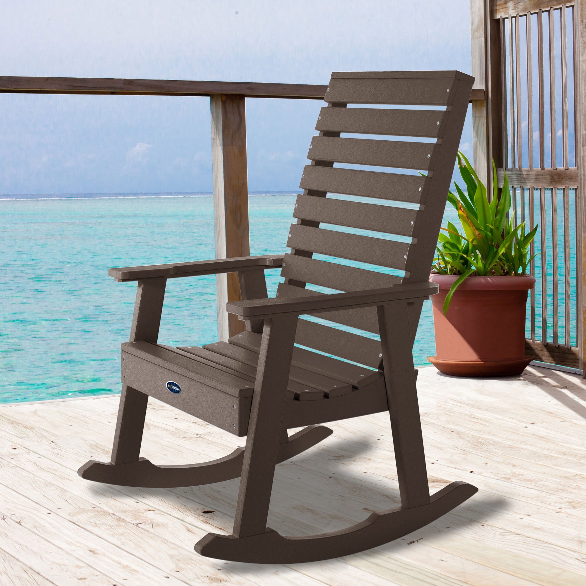 Brown Sunrise Coast rocking chair on deck overlooking water