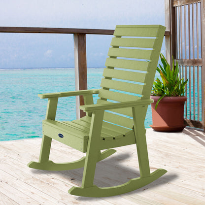 Green Sunrise Coast rocking chair on deck overlooking water