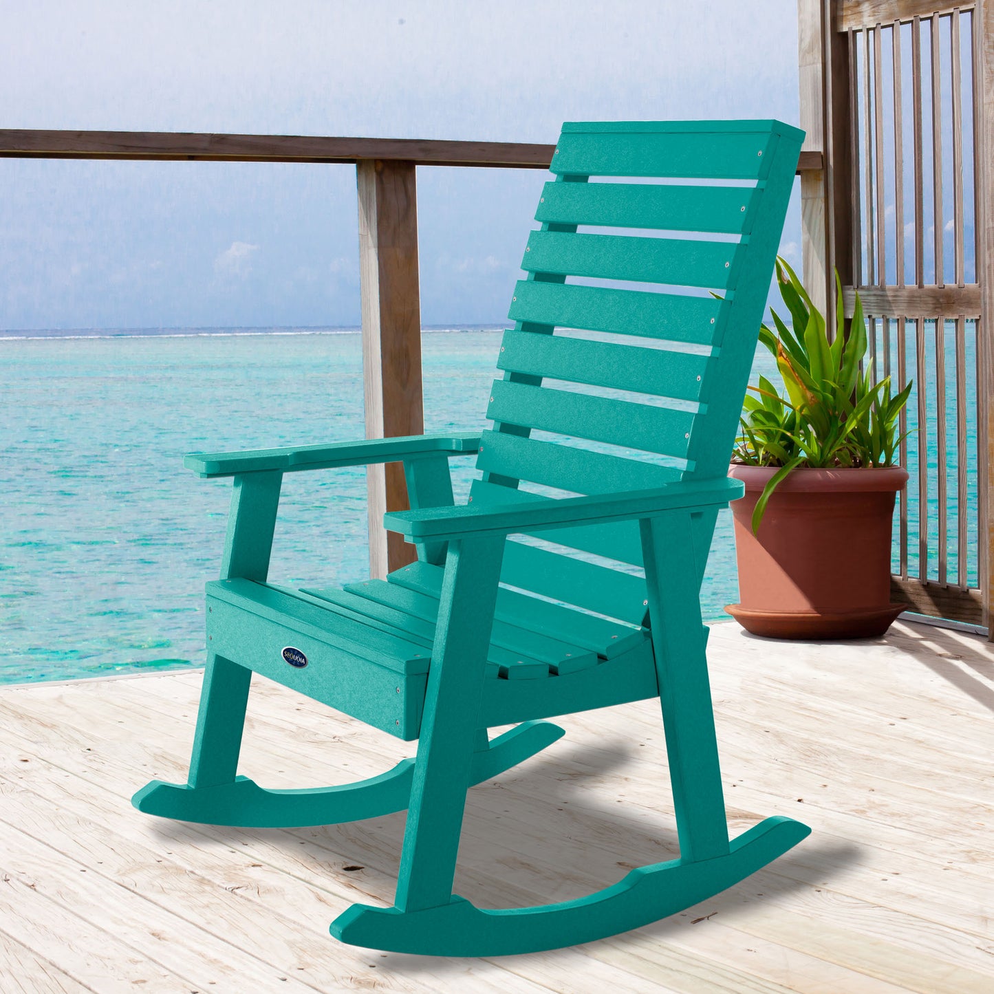 Blue Sunrise Coast rocking chair on deck overlooking water